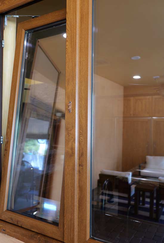 Tilt-open wooden window showcasing quality craftsmanship, enhancing interior aesthetics, and contributing to improved home comfort, reflecting VIP Smart Windows' commitment to premium window solutions.
