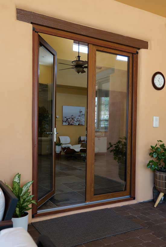 French patio doors with wood framing, showcasing a modern interior space, highlighting energy efficiency and design elegance for Arizona homes.