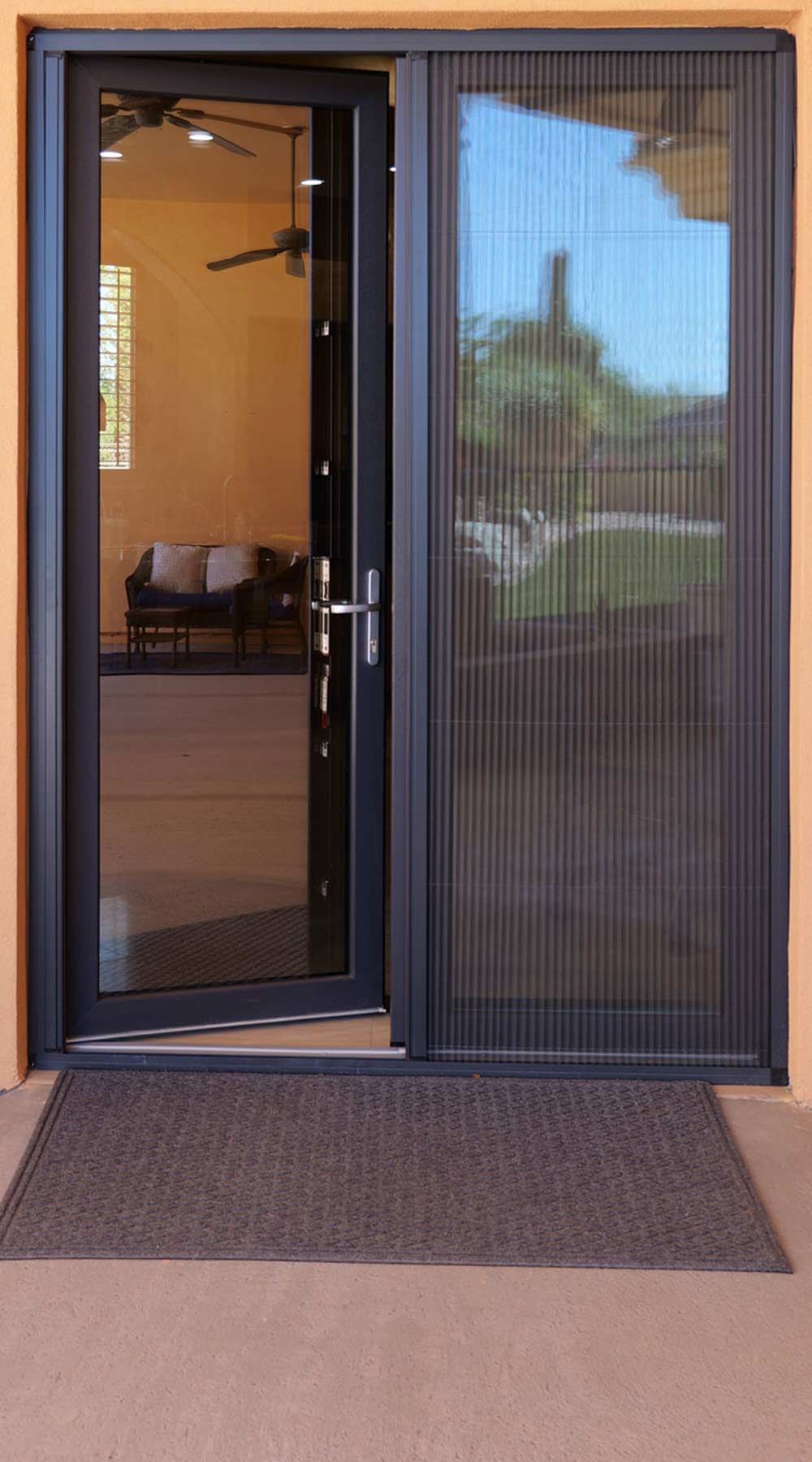 Modern rear French doors with sleek design and advanced tilt-and-turn functionality, showcasing VIP Smart Windows' commitment to quality and performance, set against a warm-colored exterior.