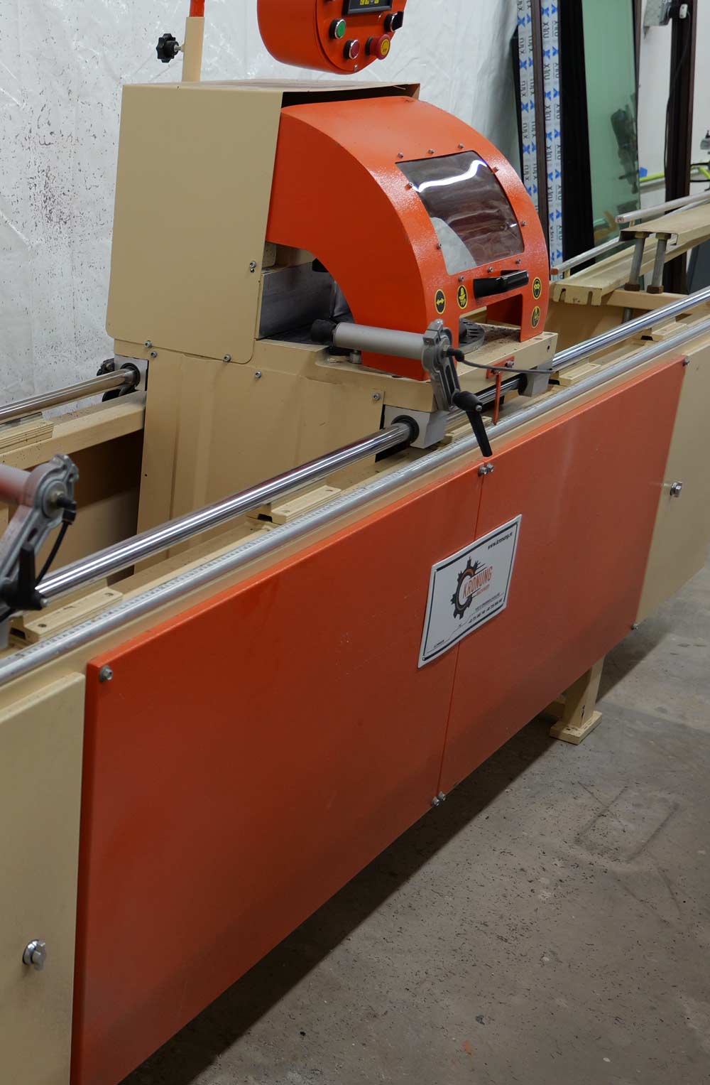 Manufacturing saw machine used for precision cutting in window and door production at VIP Smart Windows facility, emphasizing quality craftsmanship and engineering.