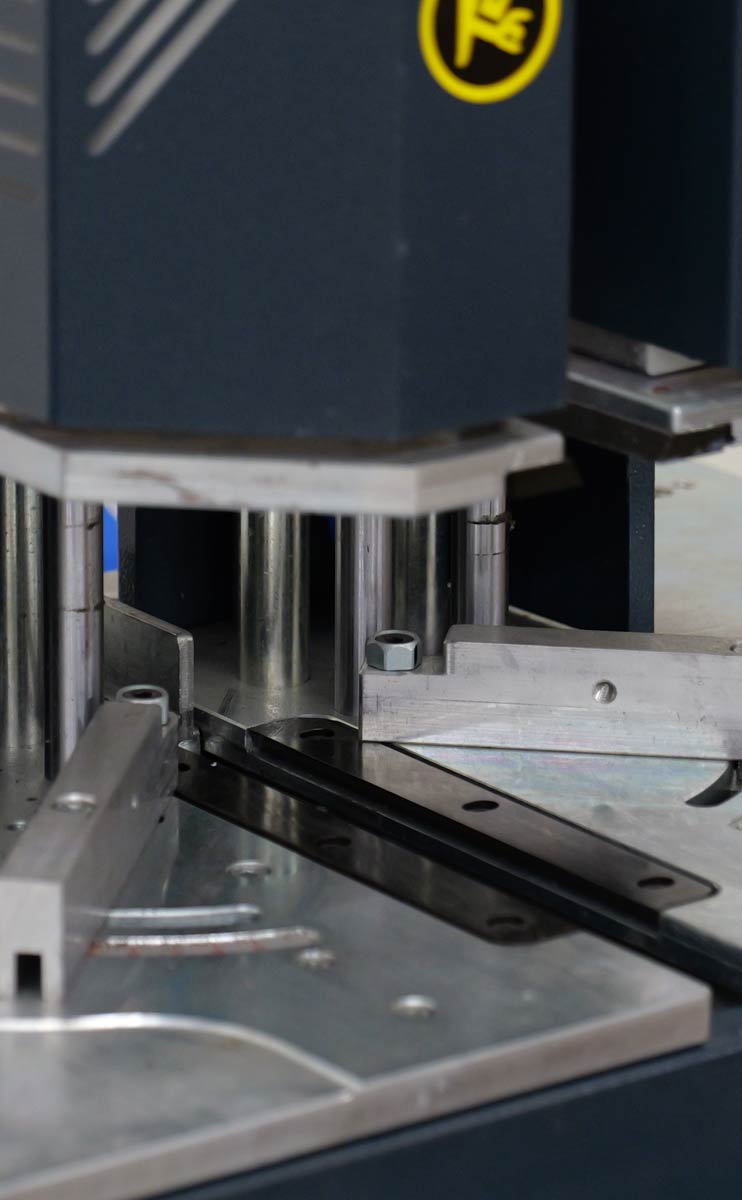 Welding machine component used in the manufacturing process of high-quality windows and doors at VIP Smart Windows, showcasing precision engineering and quality control.